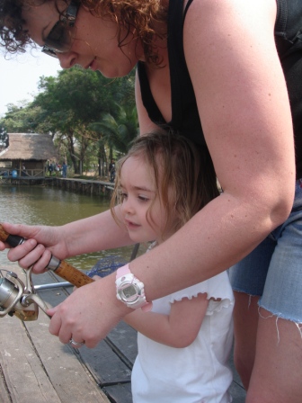 Hold it here mum, then reel it in like this, ok?